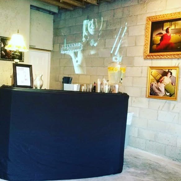 Draped portable bar set up in a private lounge space