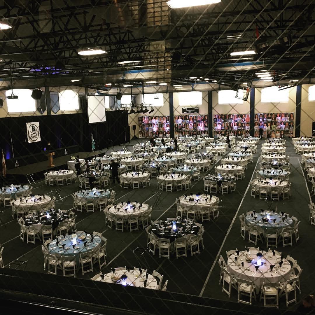 Large gala ballroom set with round tables before service